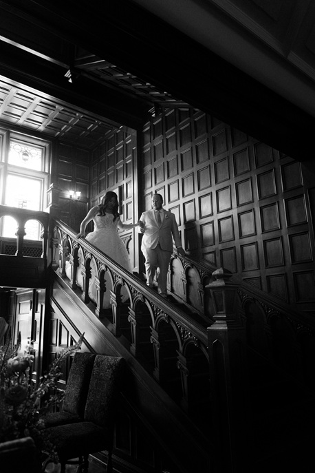 Bride and groom on grand staircase at Laurel Hall Indianapolis wedding