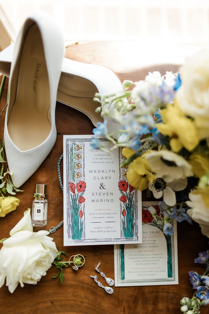 Madalyn and Steve wedding invites and details from a flat lay