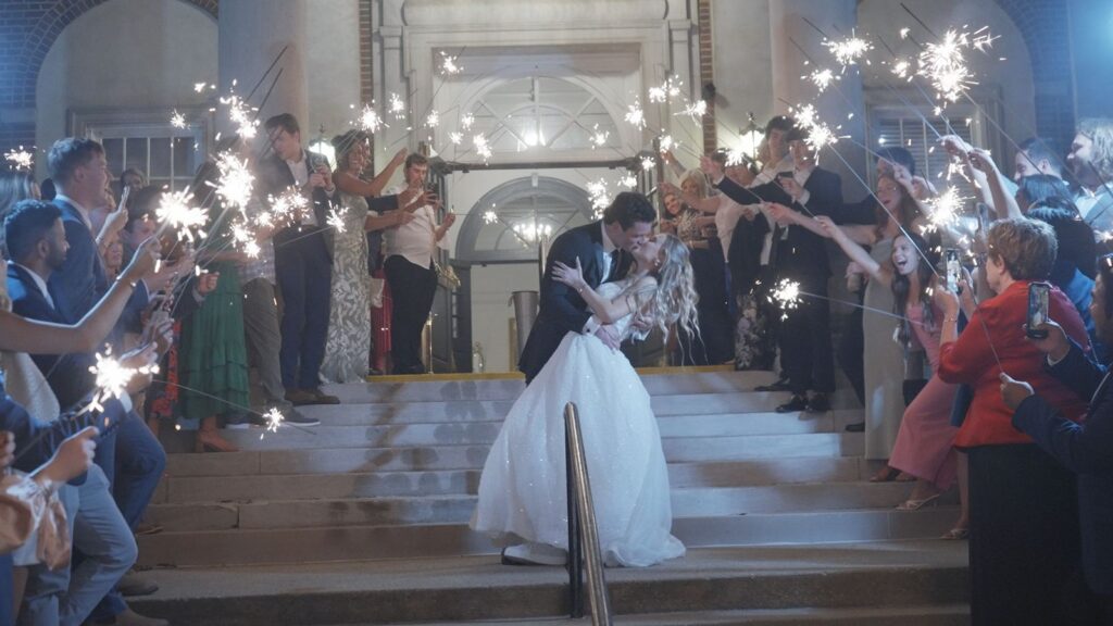 Bride and groom kissing in front of The Olmsted Wedding Venue.