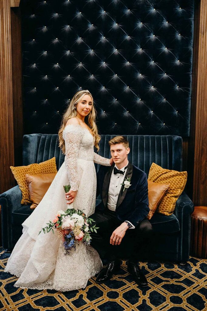 Bride and groom posing in Hotel Carmichael.