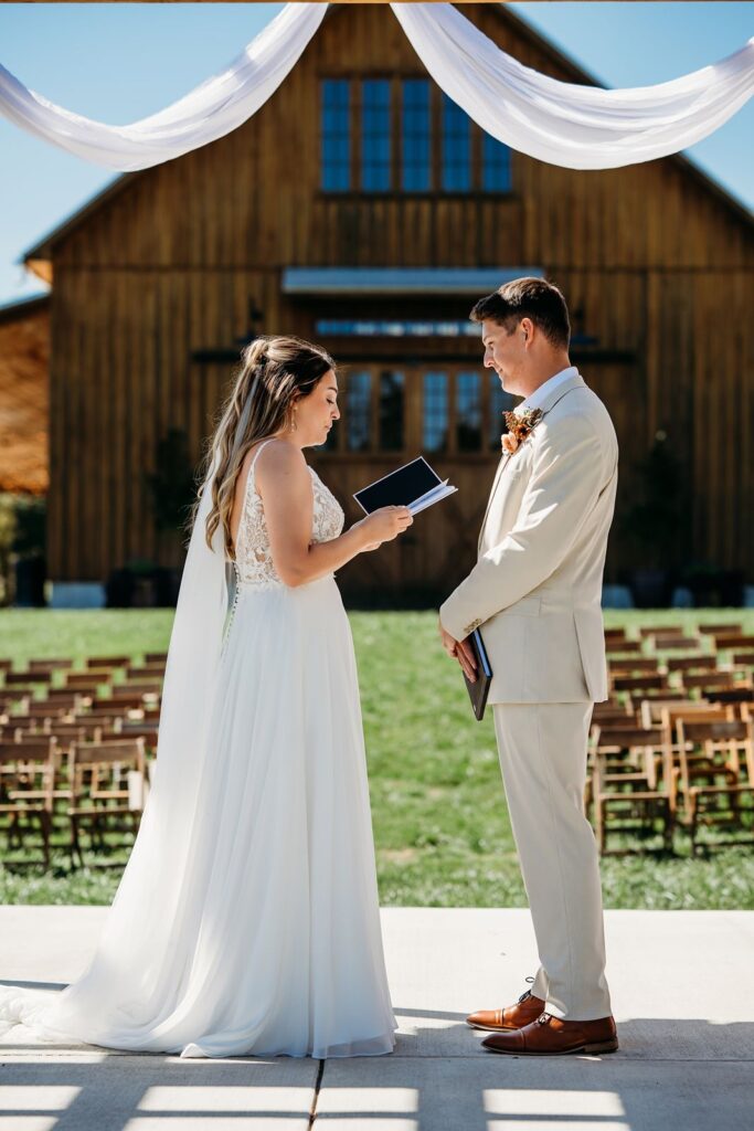 Bloomington wedding couple reading sacred vows.