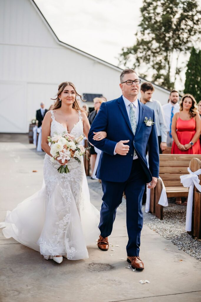 Bride walking down isle at White Willow Farms Indiana.