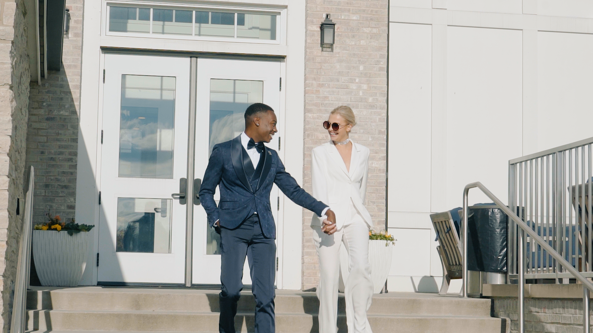 Luxury Wedding Couple Walking Down Steps